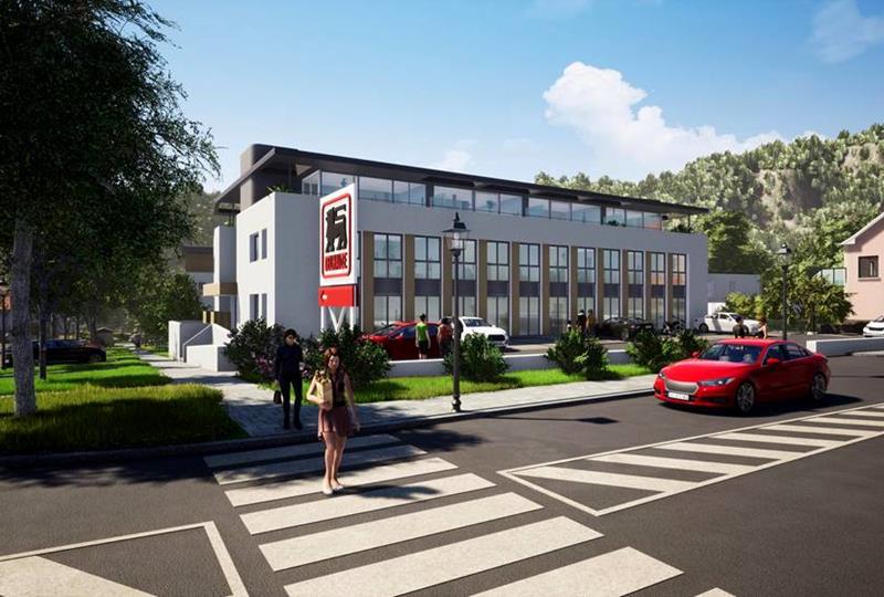 Frontansicht der Wohnresidenz Neigoart mit Einkaufszentrum